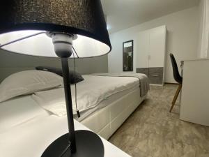 Letto o letti in una camera di Albergo Stazione