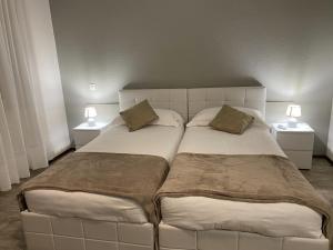 Letto o letti in una camera di Albergo Stazione