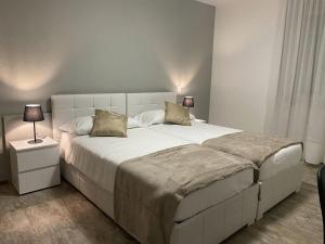 Letto o letti in una camera di Albergo Stazione