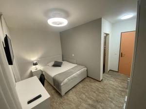 Letto o letti in una camera di Albergo Stazione