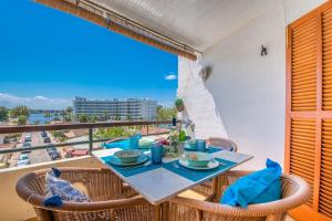 a table and chairs with a view of the ocean at Ideal Property Mallorca - Mas i Reus 10 in Alcudia