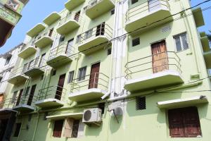 a building with balconies on the side of it at HOTEL DREAM PALACE in Puri