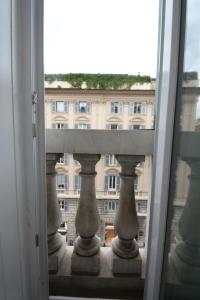 a view of a building from a window at Olympia Hotel in Genoa