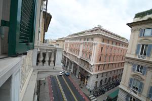 an aerial view of a street between two buildings at Olympia Hotel in Genoa