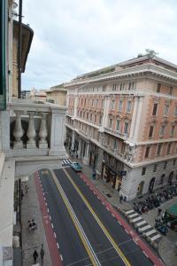 a view of a street in a city with buildings at Olympia Hotel in Genoa