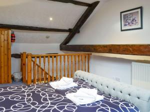 a dining room with a table with towels on it at Doddick Chase Cottage - Uk1363 in Threlkeld