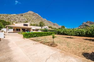 a house with a mountain in the background at Ideal Property Mallorca - Ca na Tonina in Port de Pollensa