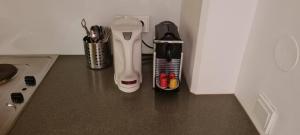 a kitchen counter with a toothbrush and other utensils at Aparthotel Bianca in Vienna in Vienna