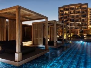 a rendering of a hotel with a swimming pool at Ammades All Suites Beach Hotel - Adults Only in Faliraki