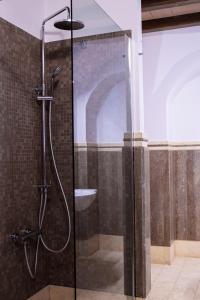 a bathroom with a glass shower with a sink at Palazzo Sant'Elena in Foggia