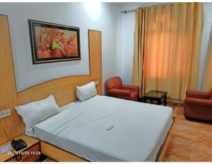 Postelja oz. postelje v sobi nastanitve Hotel Kishore International, Amritsar