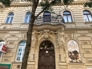 a building with a door and a balcony above it at Anna 2 bedrooms 2 bathrooms 6 bikes in Budapest