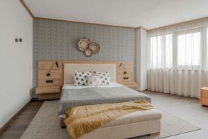 a bedroom with a large bed and a large window at WN LAB Hotel - inclusive breakfast, parking and coworking in Sofia