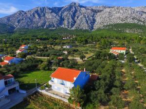 an aerial view of a village with mountains in the background at Apartments Ivana in Orebić