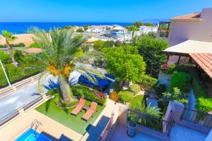 an aerial view of a villa with a palm tree at Villa Arbanassi in Lachi