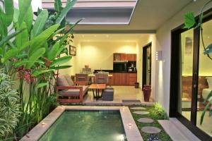 a small swimming pool in the middle of a house at Bali Corail Villas in Kerobokan
