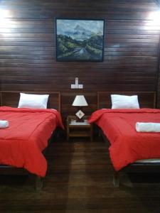 Кровать или кровати в номере Lembongan D'lick