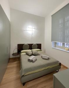 A bed or beds in a room at Il Nido Incantato in Centro