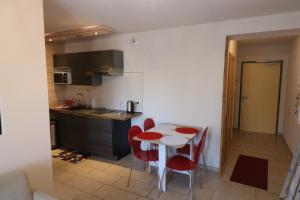 A kitchen or kitchenette at Suite 1 - Le Rocher