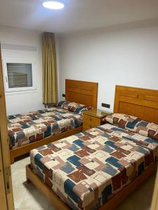 Cama ou camas em um quarto em Restinga Marina Smir Luxury Sea View