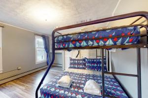 a bedroom with two bunk beds in a room at Written in the Stars in Penn Yan