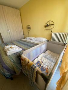 Posteľ alebo postele v izbe v ubytovaní Appartamento Eliana + 13 fotografií