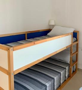 a bunk bed in a room with a mattress at CORTE COLOMBARON vicino a Gardaland in Ronchi