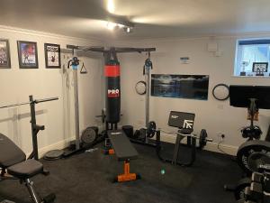 a room with a gym with equipment in it at The Old Court House & Jail in Menai Bridge