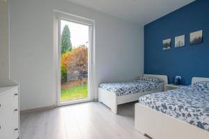 Postel nebo postele na pokoji v ubytování Happy Guest Apartments - Blue Apartment