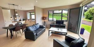 a living room with a couch and a table at Banana Tree Lodge in Jamestown