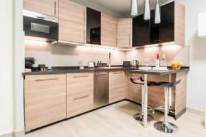 A kitchen or kitchenette at Mia Suite. Center of Seville