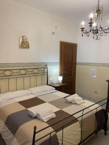 A bed or beds in a room at [Casa sul mare]+Posto auto+Giardino+WiFi Még 37 kép