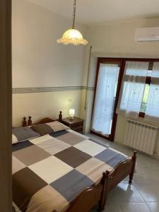 A bed or beds in a room at [Casa sul mare]+Posto auto+Giardino+WiFi