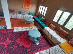 an overhead view of a living room with a couch at jardin du desert in Mhamid