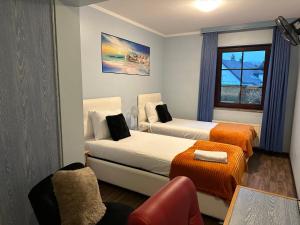 Postel nebo postele na pokoji v ubytování Hotel L'Empire