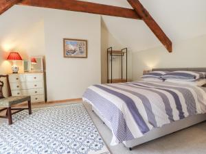 Postel nebo postele na pokoji v ubytování Mill Cottage