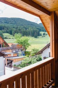 a view from the balcony of a log cabin at Stranachwirt Apartments in Sankt Michael im Lungau