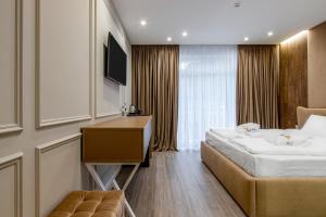 Letto o letti in una camera di Olimp Hotel