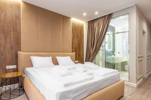 Letto o letti in una camera di Olimp Hotel
