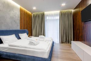 Letto o letti in una camera di Olimp Hotel