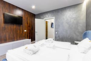 Letto o letti in una camera di Olimp Hotel