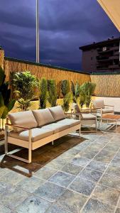 a group of couches sitting on a patio at AMERICAN GARDEN HOUSE in Nettuno