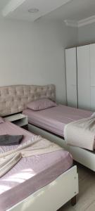 Cama ou camas em um quarto em Midtown Hotel Apartments 401 (2+1)