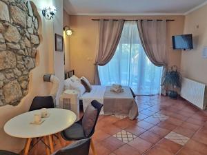 a room with a bed and a table and chairs at Leonarda in Crikvenica