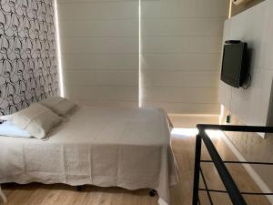 Кровать или кровати в номере Duplex NYC Berrini 1 dormitório - ao lado do WTC