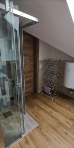 a bathroom with a glass shower in a room at lovely apartment 