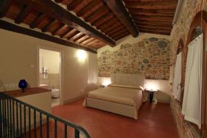 Giường trong phòng chung tại Agriturismo San Martino