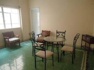 a room with a table and chairs and a window at Hotel Suites Córdoba in Córdoba +25 photos
