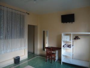 TV a/nebo společenská místnost v ubytování Hotel Suites Córdoba