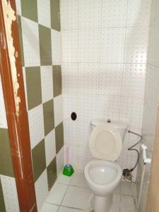 a bathroom with a white toilet in a stall at Mamaya Hotel in Amman